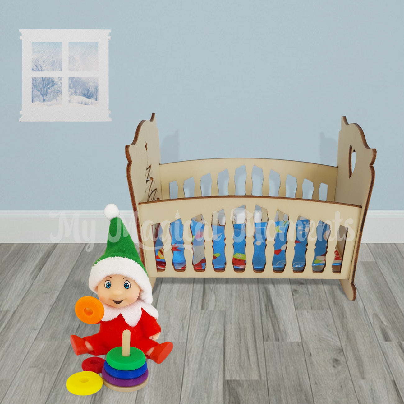 Elf baby playing with a ring stacker prop