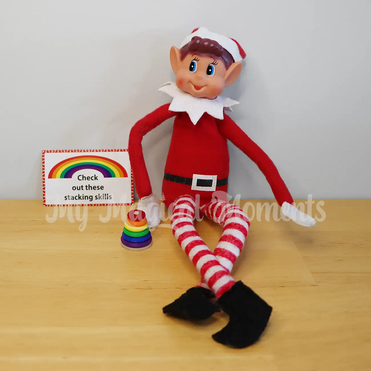 Elf with a miniature stacking toy prop