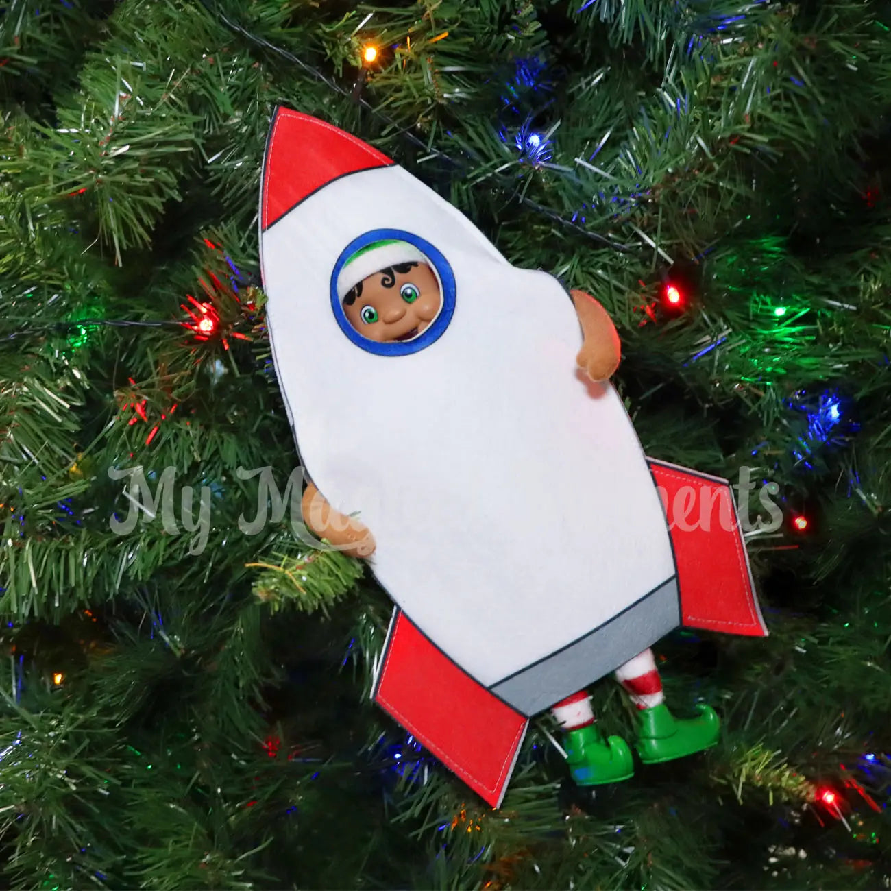 My Elf Friends wearing a Rocketship costume in a Christmas Tree