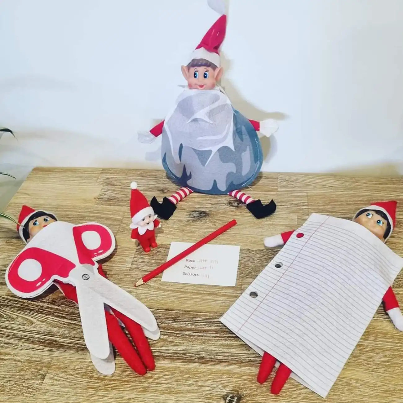 Elf customer scissors paper rock scene