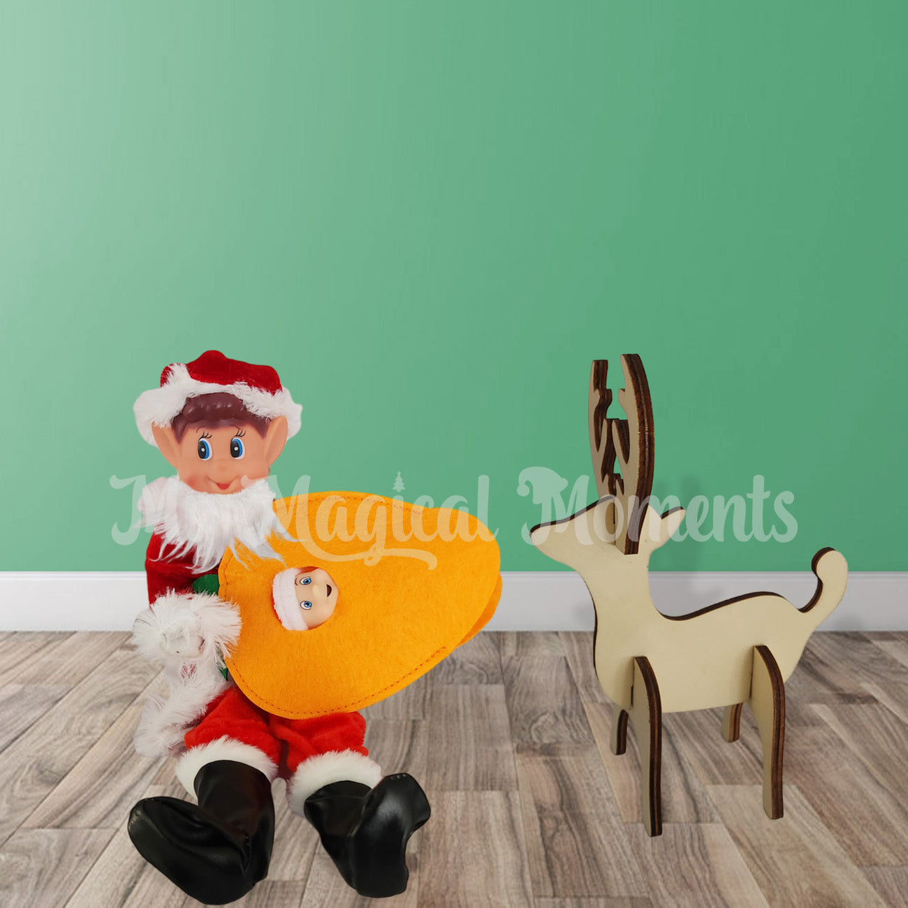 Santa Elf feeding Reindeer with baby elf carrot