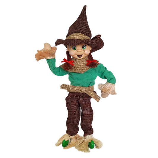 elf wearing a scarecrow costume