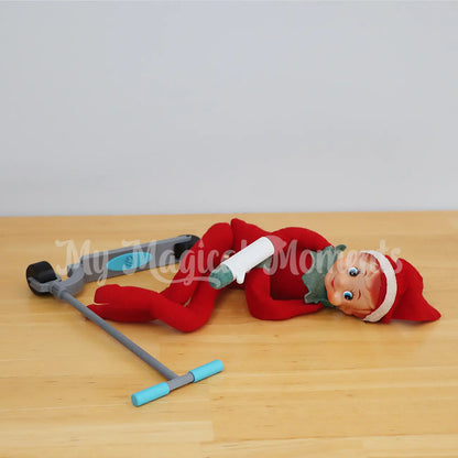 Elf falling down on a scooter breaking arm with mini elf cast