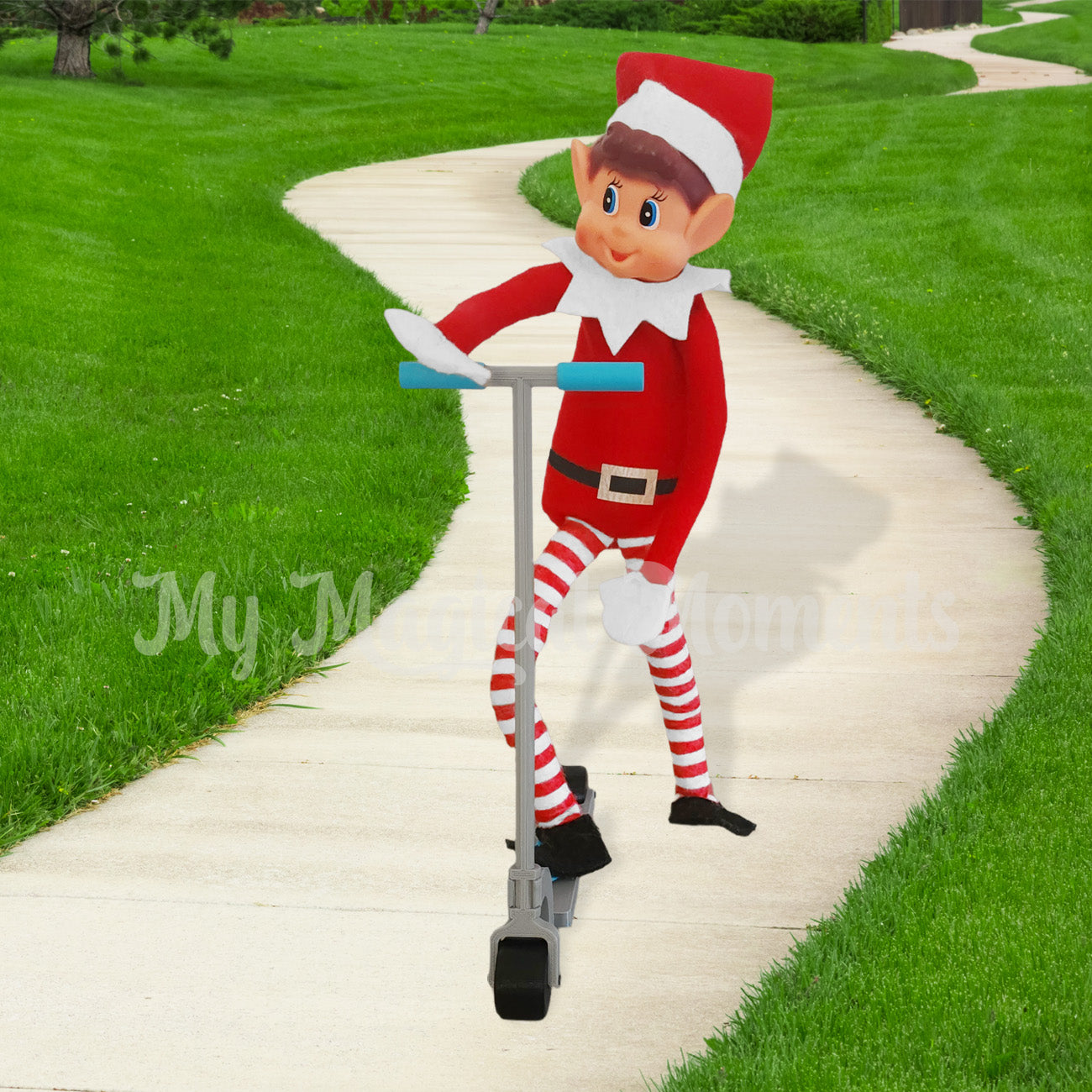 Elves behaving badly using an elf sized scooter prop on a footpath
