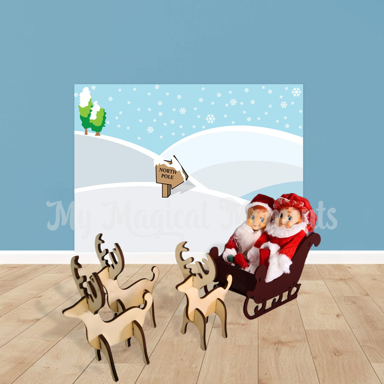 Elves dressed Santa and Mrs Claus riding in a sleigh pulled by wooden reindeer ornaments
