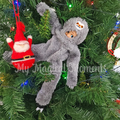 elf dressed as a sloth in a Christmas tree