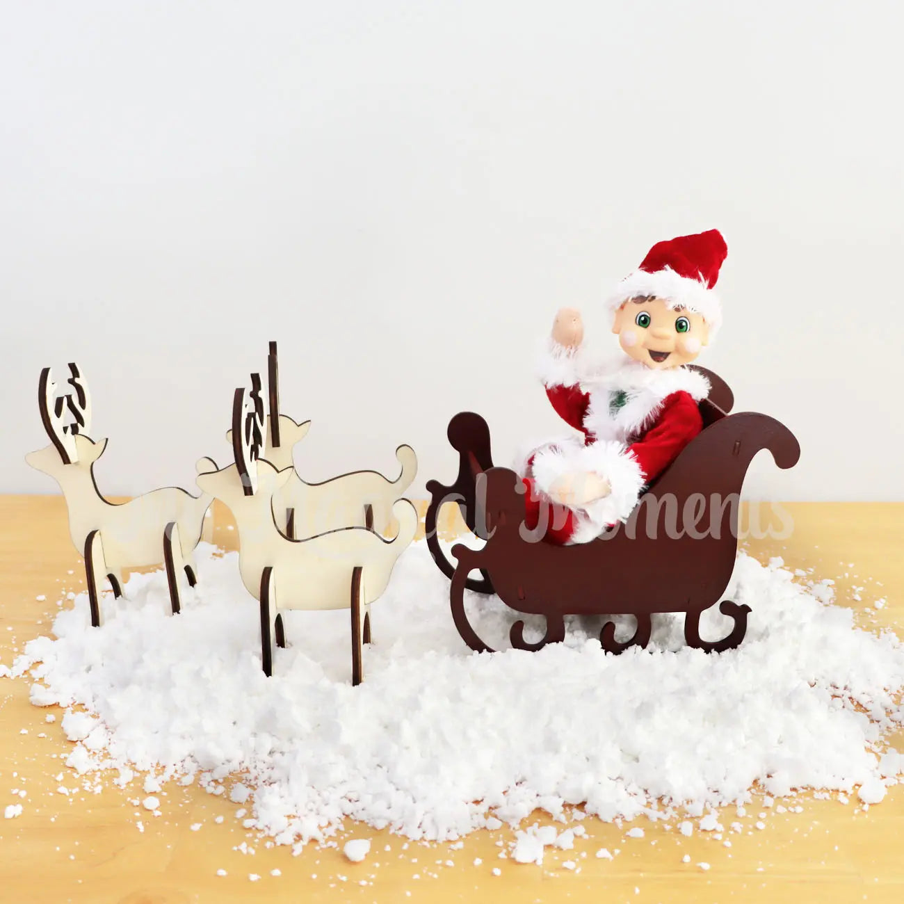 Brown Hair My Elf Friends wearing a Santa costume in a sleigh and with wooden reindeers