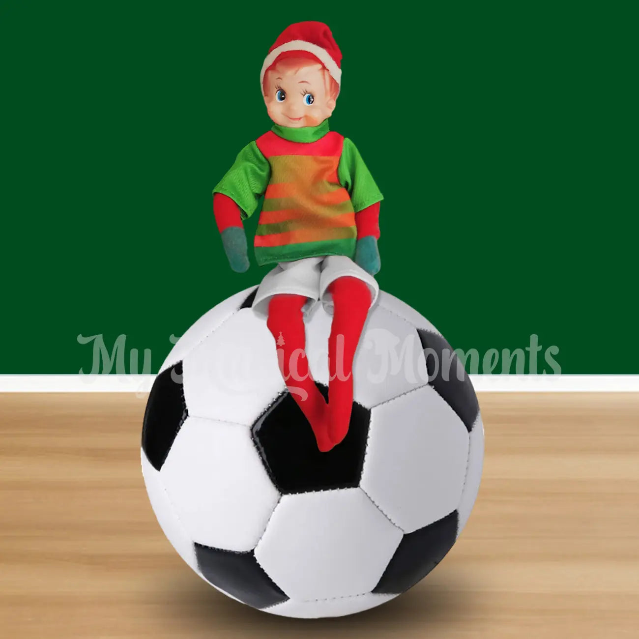 Elf wearing a soccer outfit sitting on a soccer ball