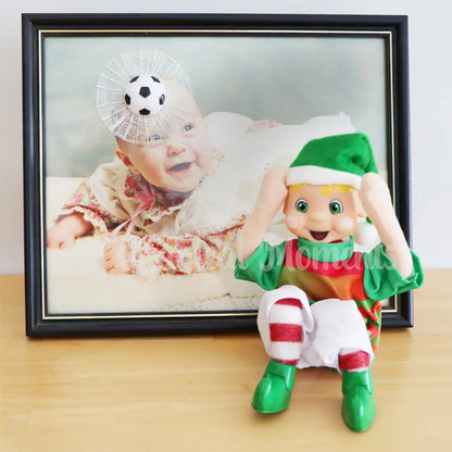 Elf upset for hitting a soccer ball into a picture frame