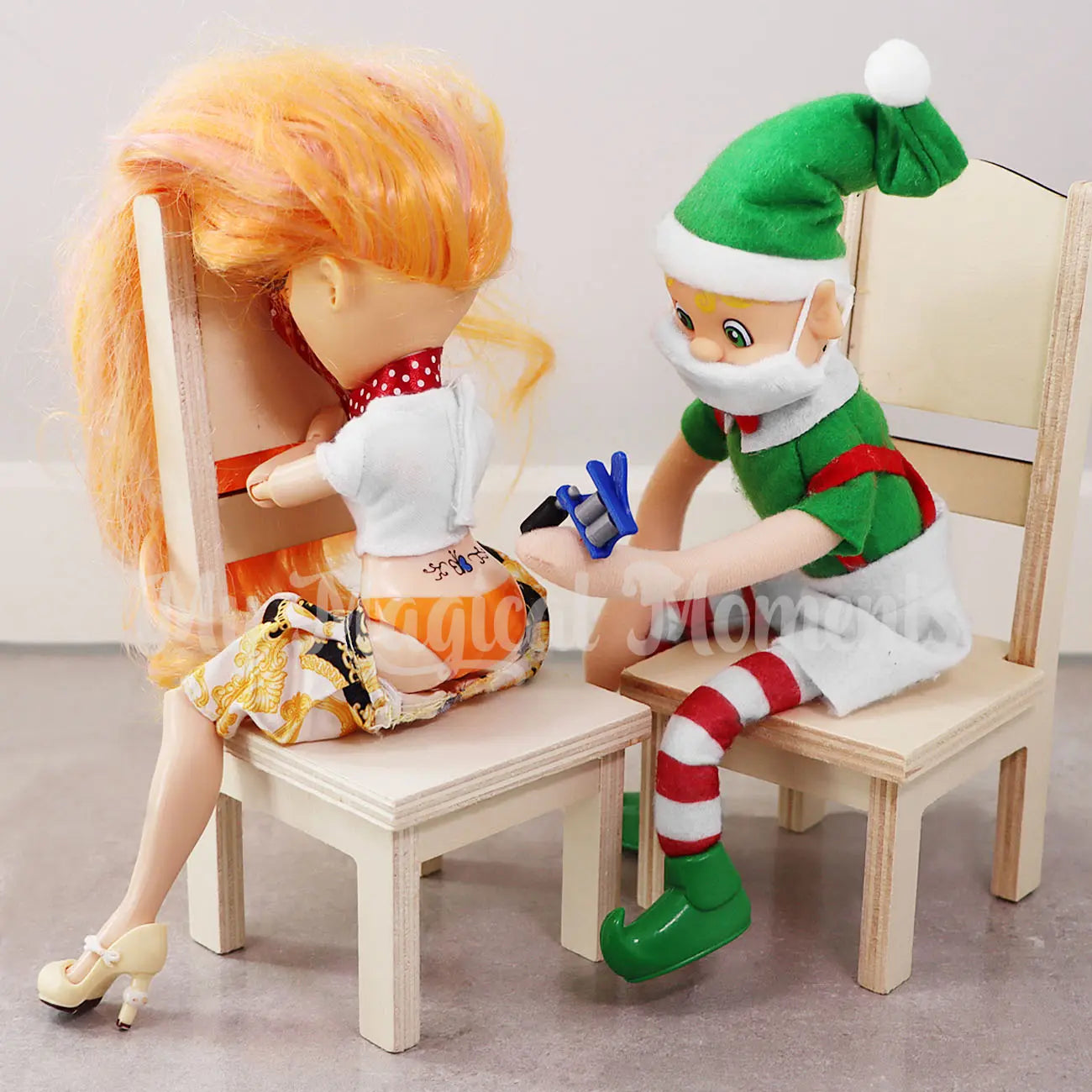 My Elf Friends Bendable Elf tattooing Barbie with a elf face mask