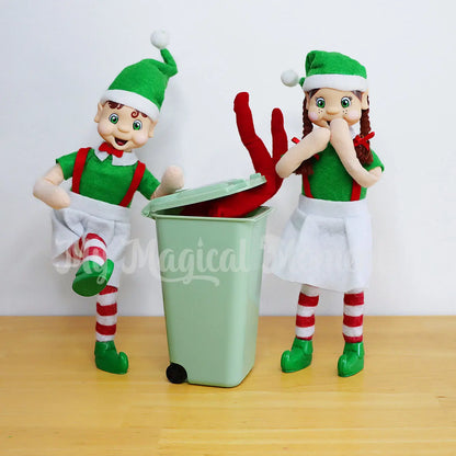 Elves throwing an old elf in the bin