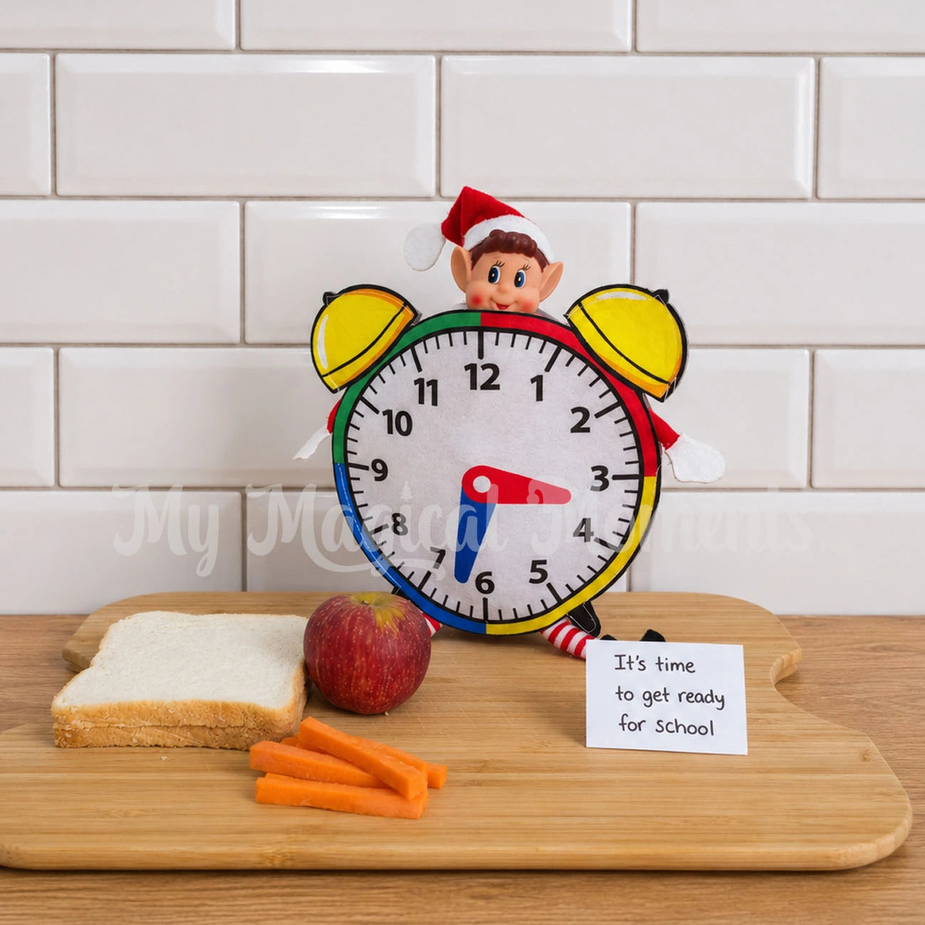 Elf wearing a clock costume on a chopping board in the kitchen, with school lunch, a note saying it's time to get ready for school