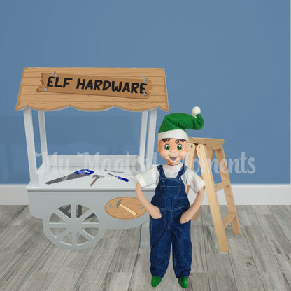 elf in overalls selling tools and a ladder at miniature hardware store