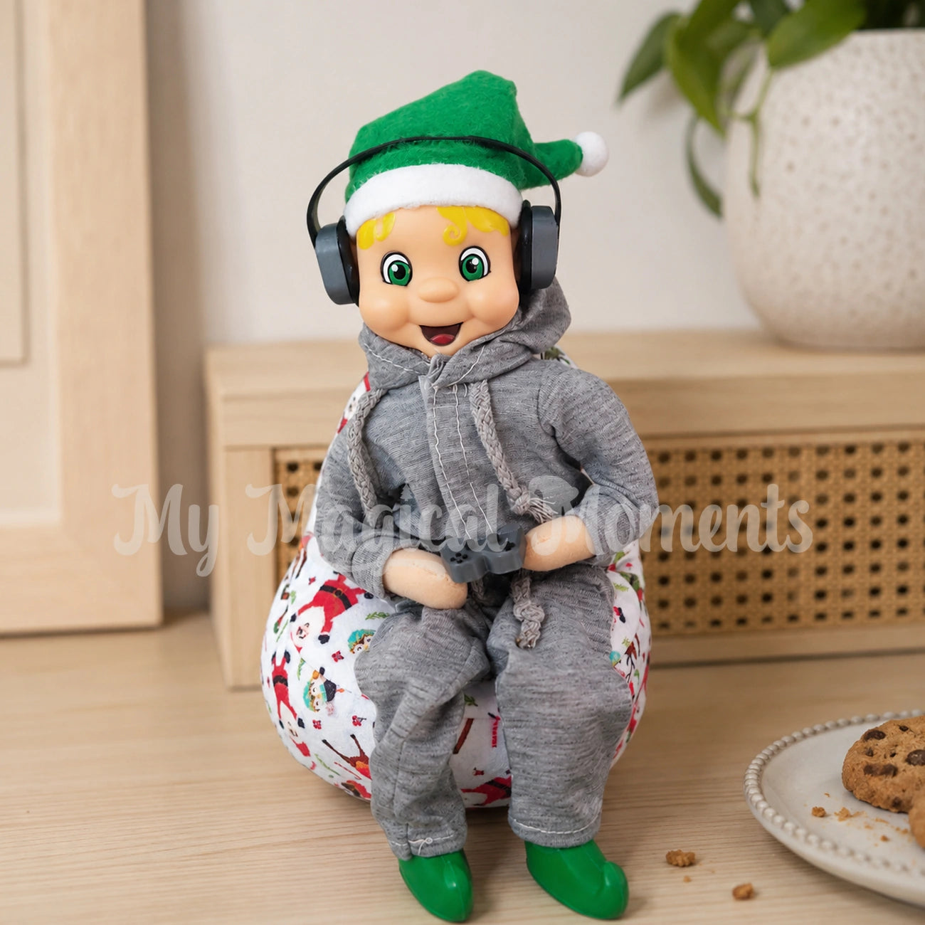 elf wearing a tracksuit, sitting on a beanbag wearing headphones and playing a gaming set