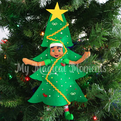 Black Hair elf wearing a Christmas tree costume in a decorated Christmas Tree