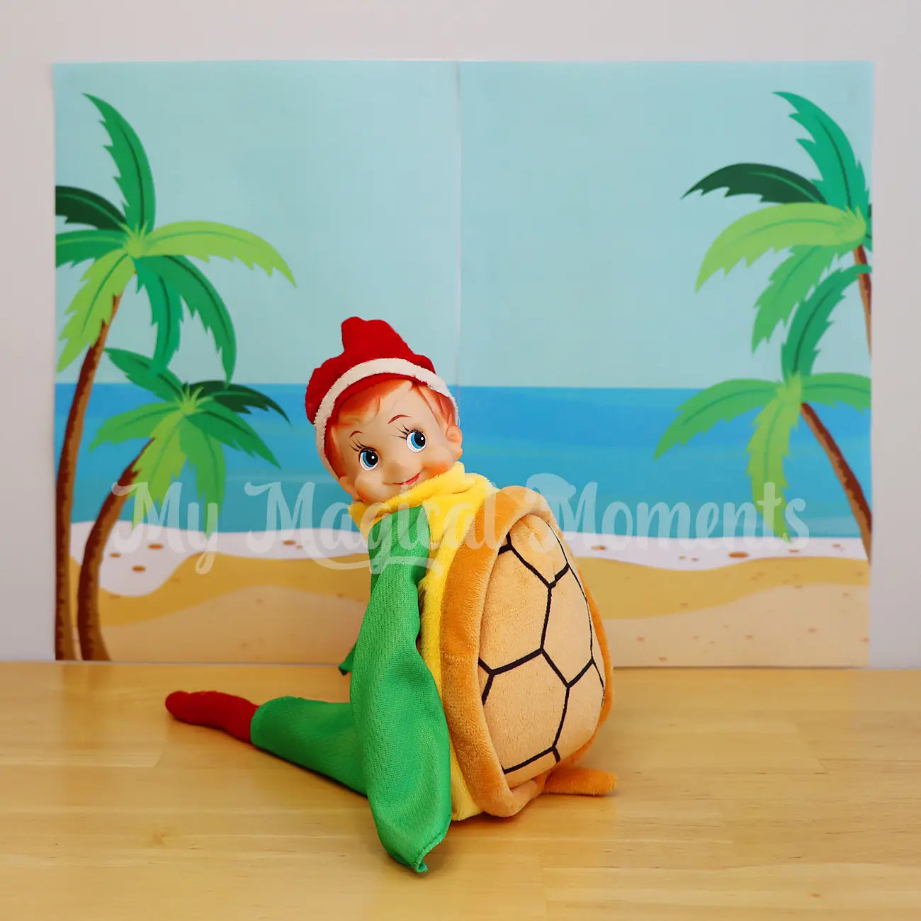 elf wearing a turtle costume in front of a beach scene printable