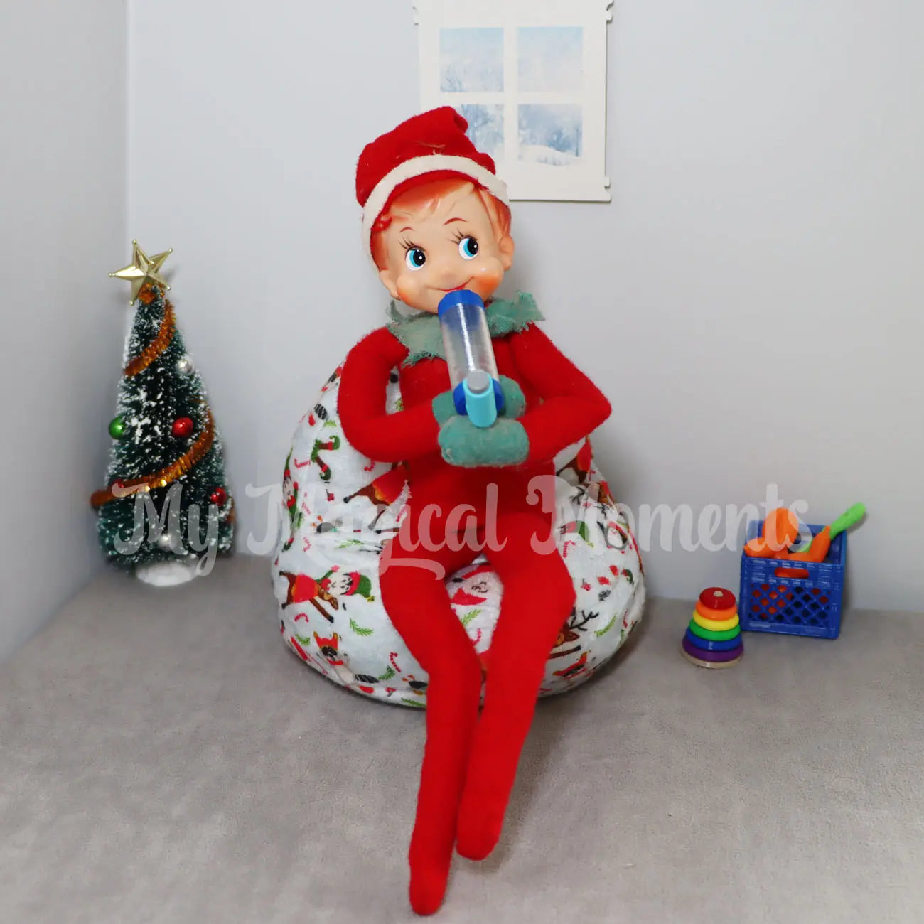 Vintage elf using a miniature elf puffer in a room with a Christmas tree and elf props