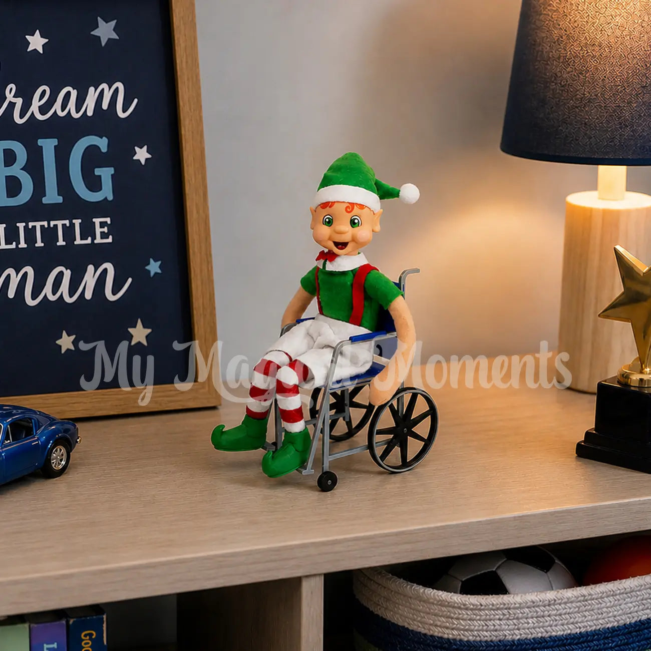 My elf friends in a blue wheel chair in a bedroom
