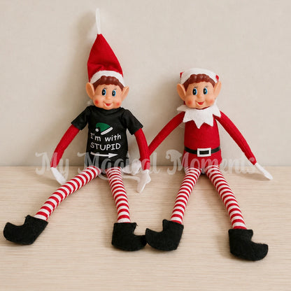Elves behavin badly elf wearing an I'm with stupid shirt sitting next to another elf