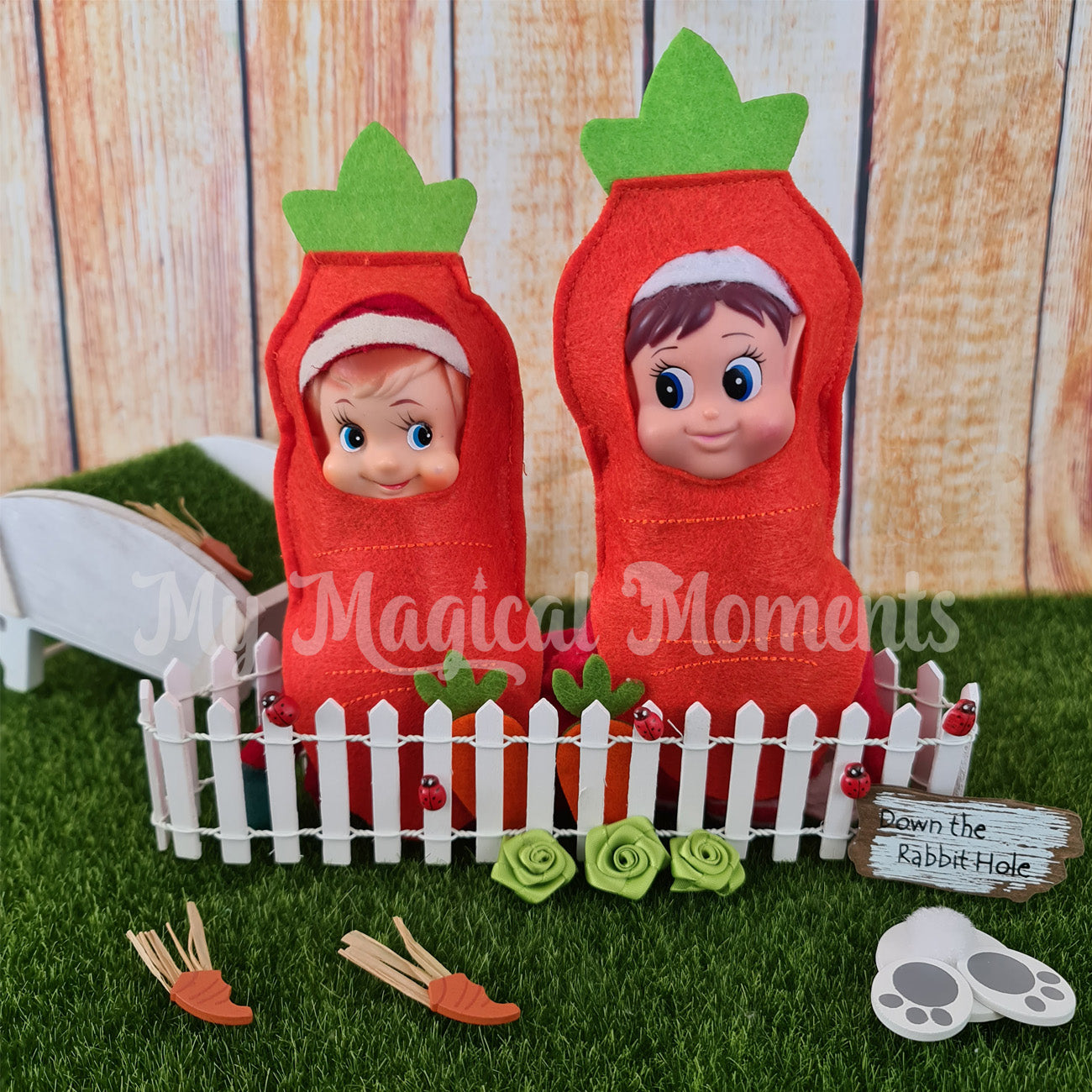 elves dressed as carrots with a wheelbarrow