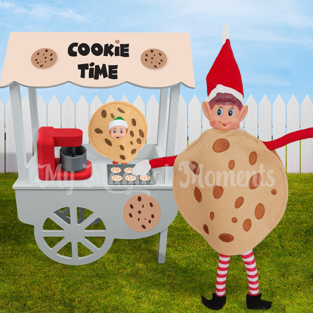 Elves behavin badly dressed as a cookie With a baby cookie selling baked goods