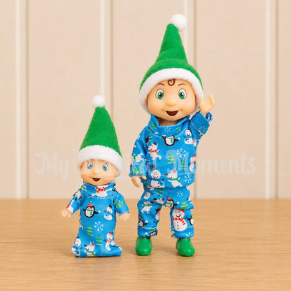 Elf baby and elf toddlerwearing matching pyjamas
