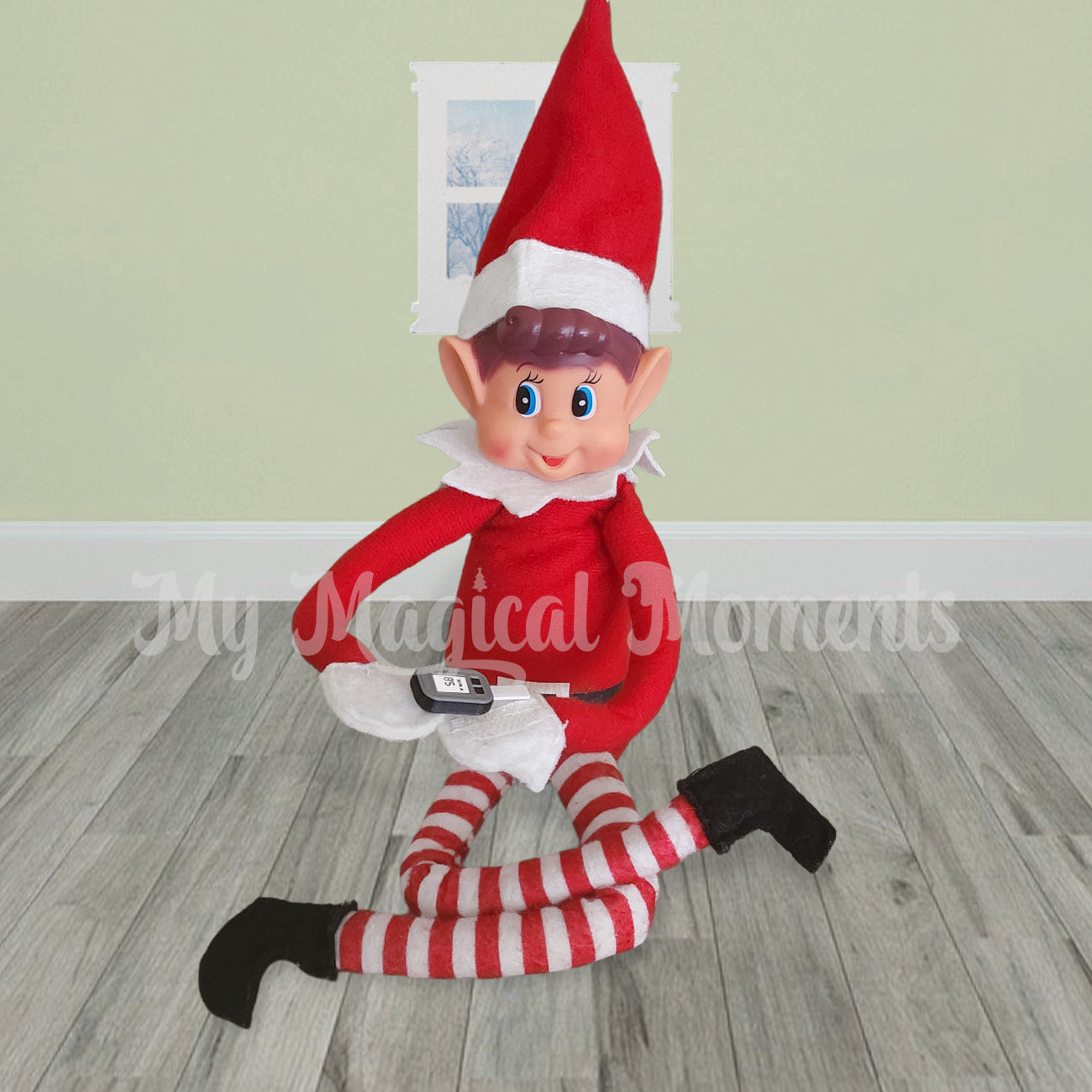 Elves behavin badly sitting in a room with a miniature glucometer prop