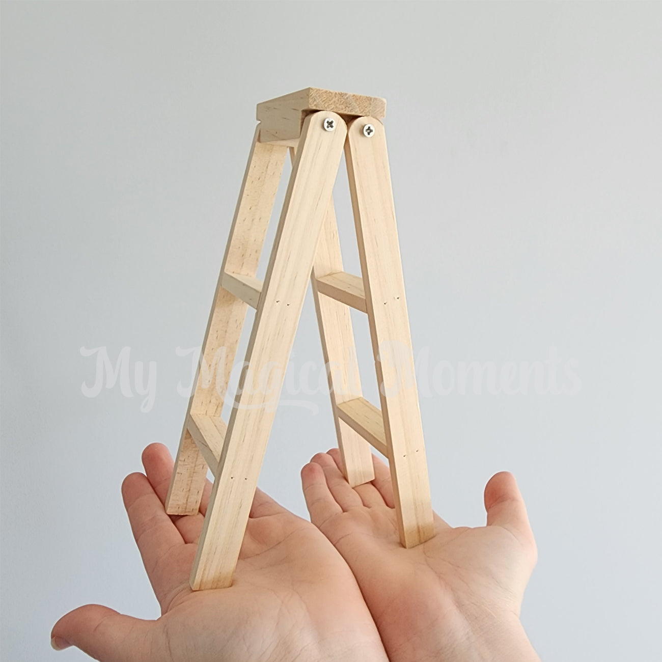 Wooden ladder elf prop comparison in human hands