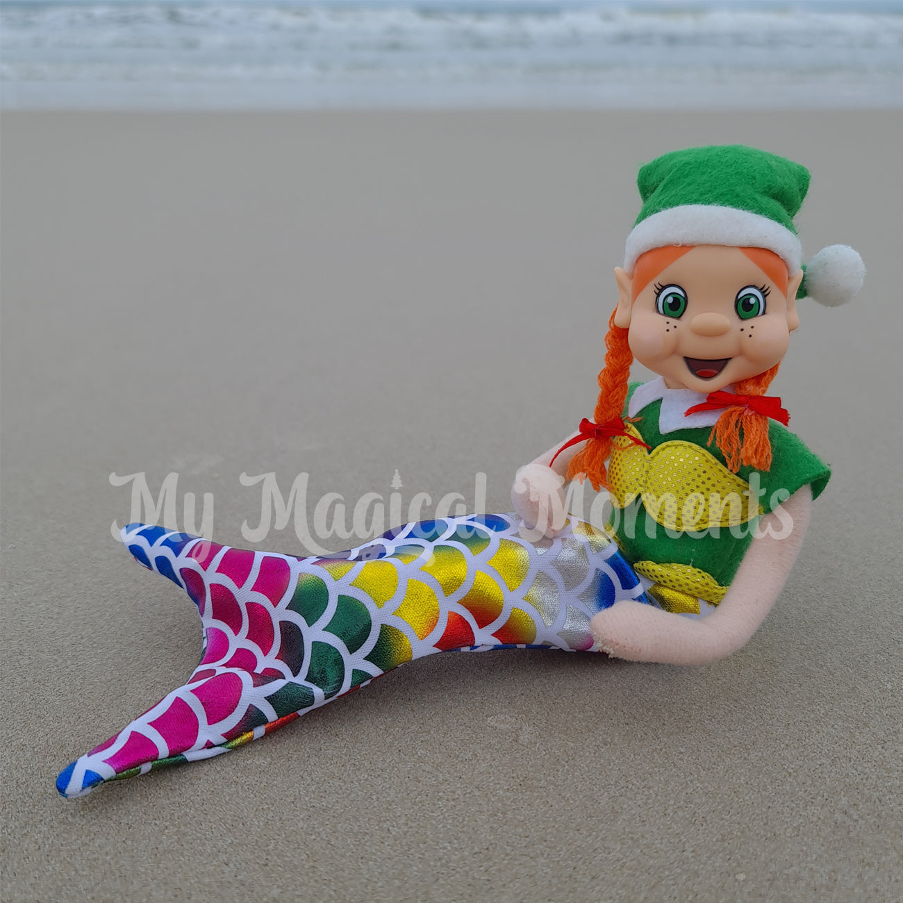 Elf wearing a mermaid dress up at the beach