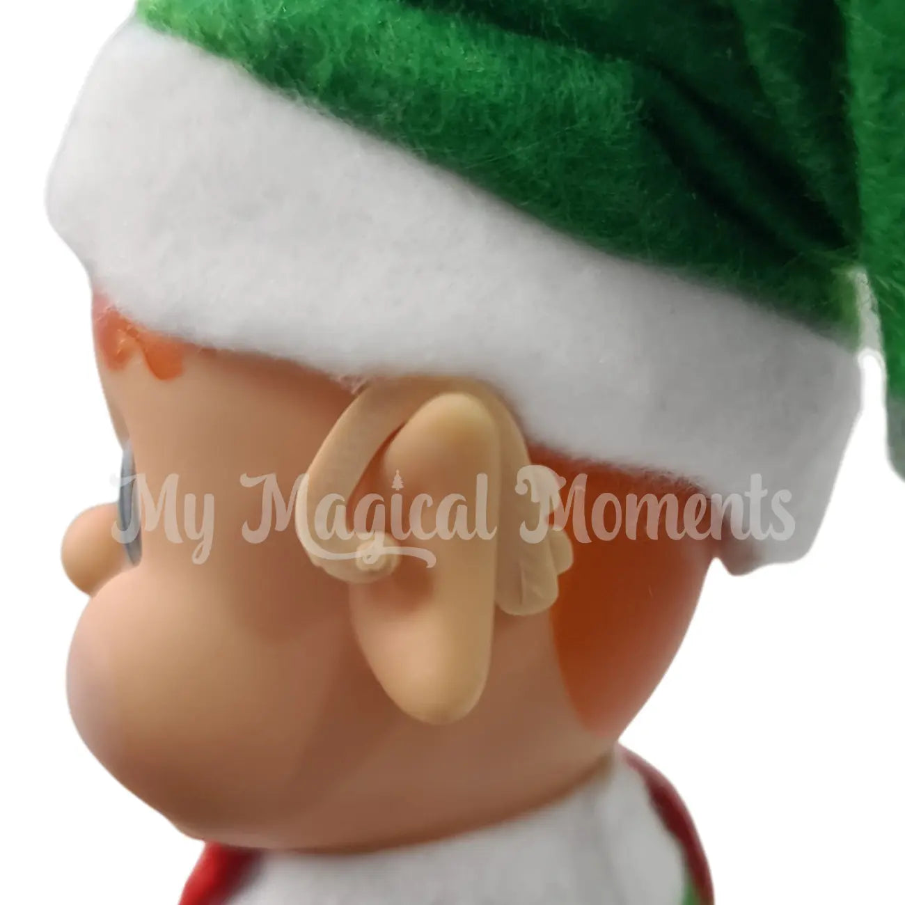 My Elf friend wearing a miniature elf sized hearing aid