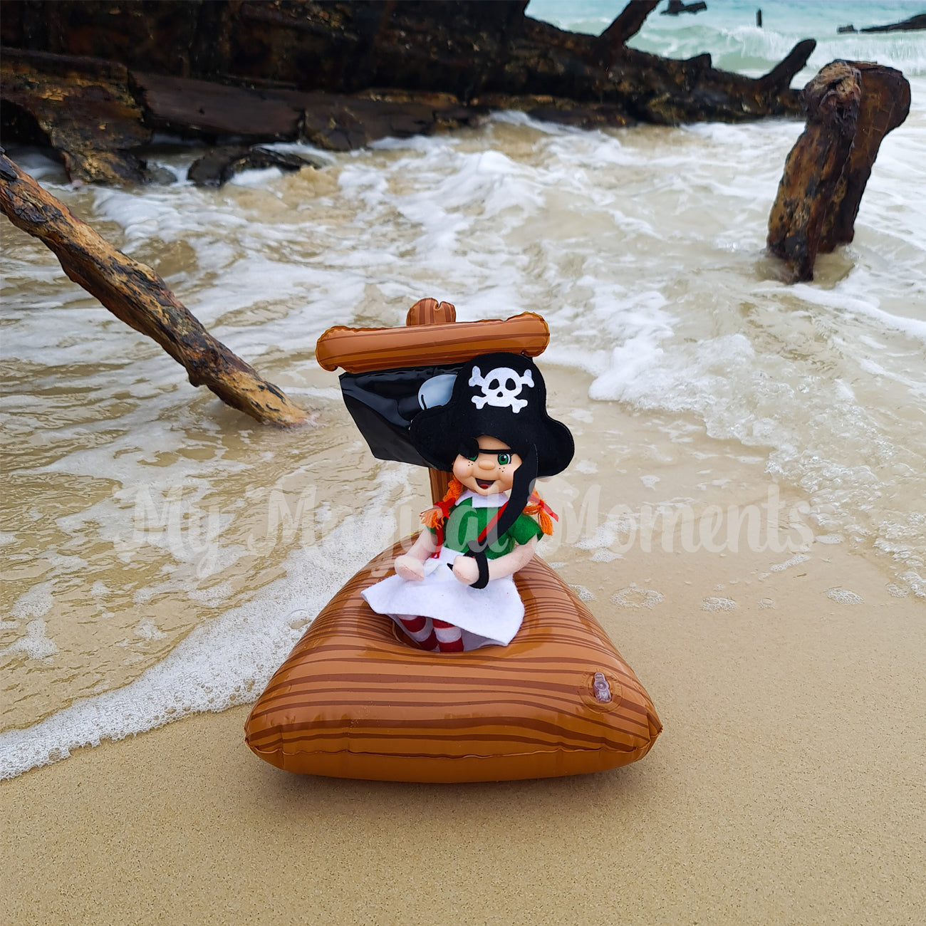 Girl elf dressed in a pirate costume on beach