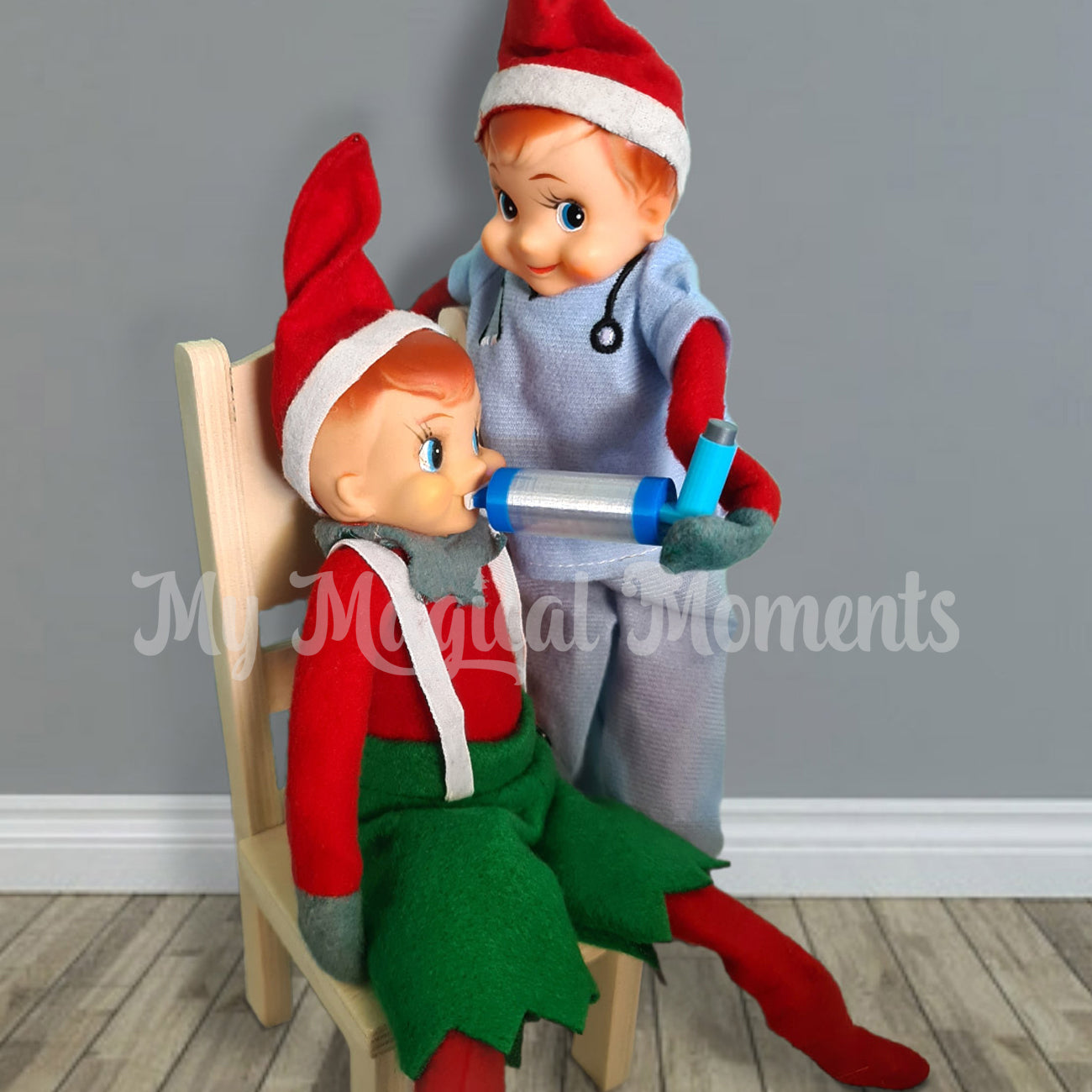 Elf dressed as nurse giving a puffer to an asthmatic elf