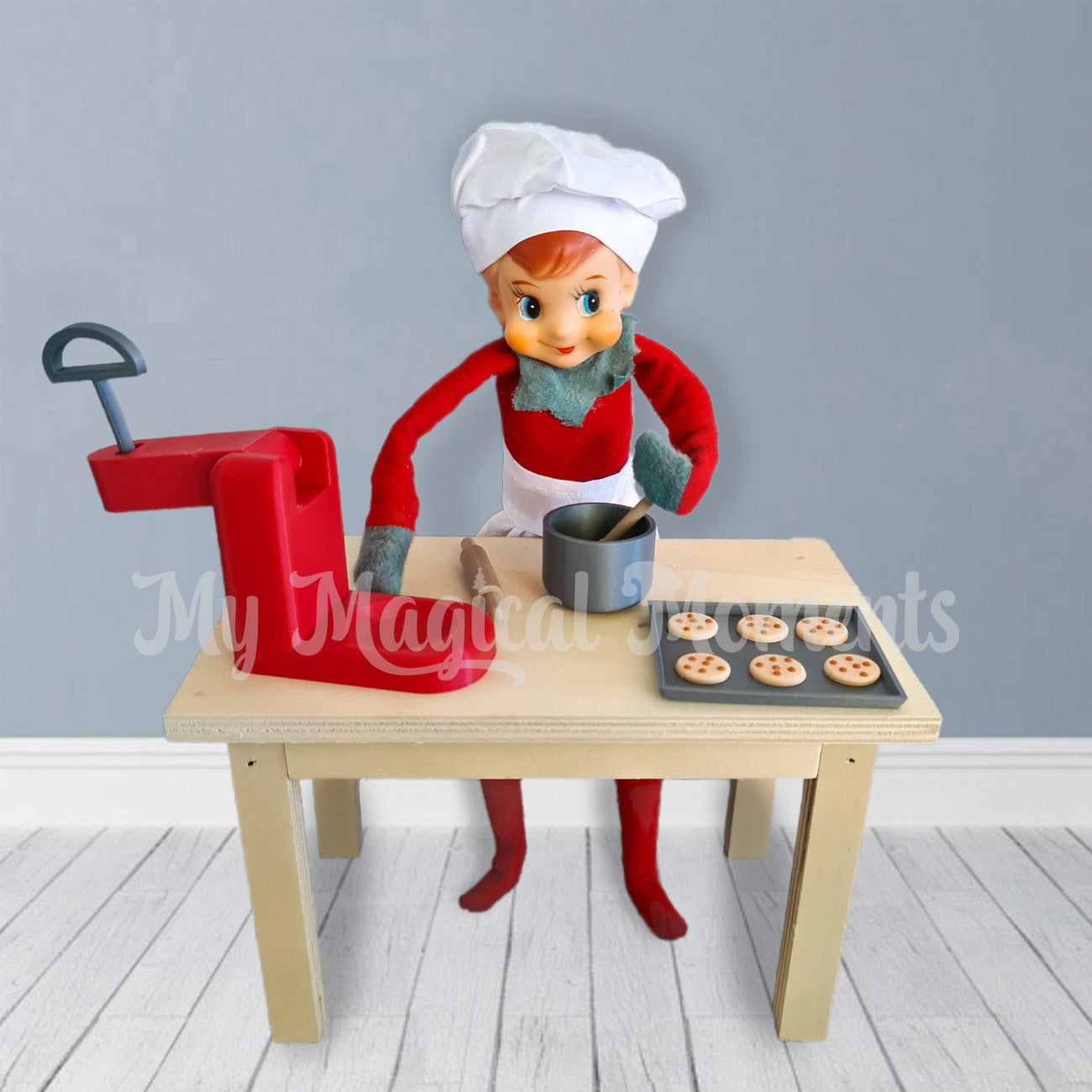 Elves behavin badly baking chocolate chip cookies with his miniature mixer