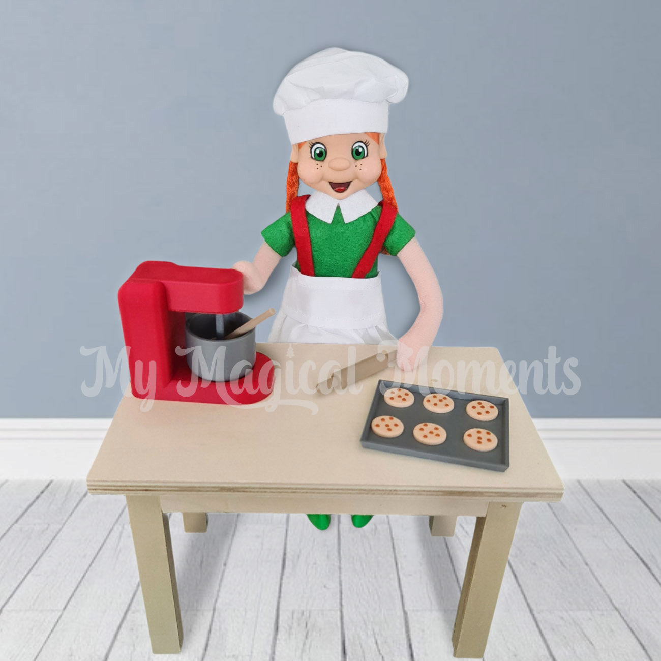 Elf making cookies with mini baking set