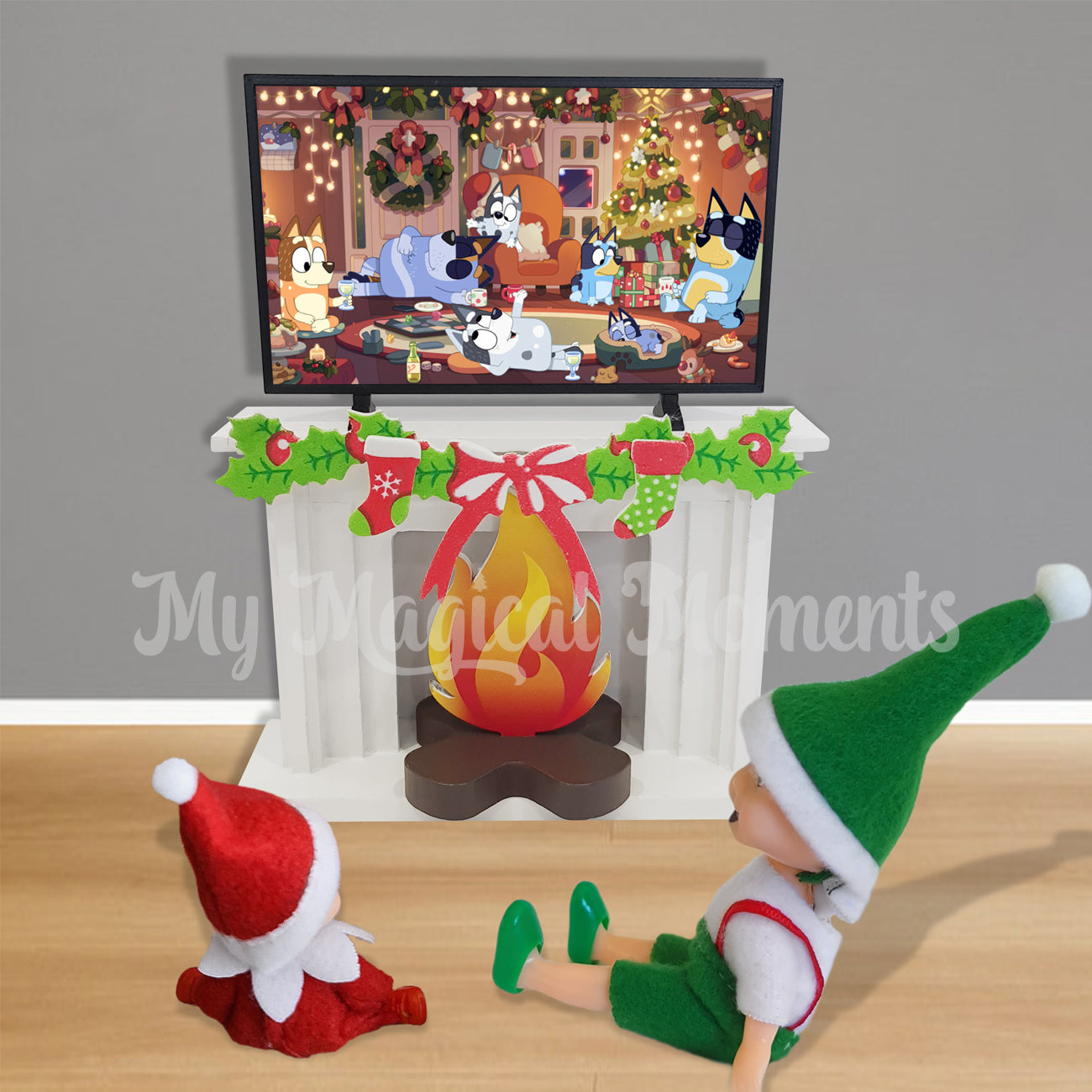 Elf toddler and elf baby watching a Christmas bluey episode on the elf tv.