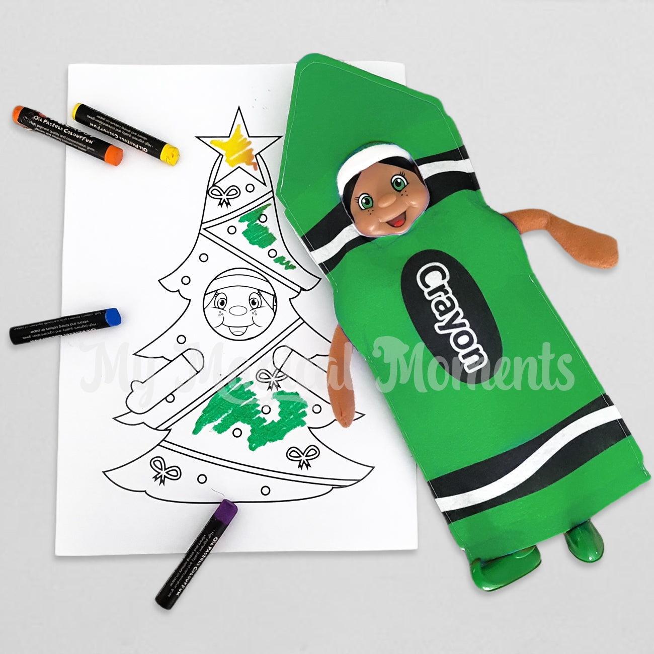 Black hair elf dressed as a green crayon colouring her self with crayons