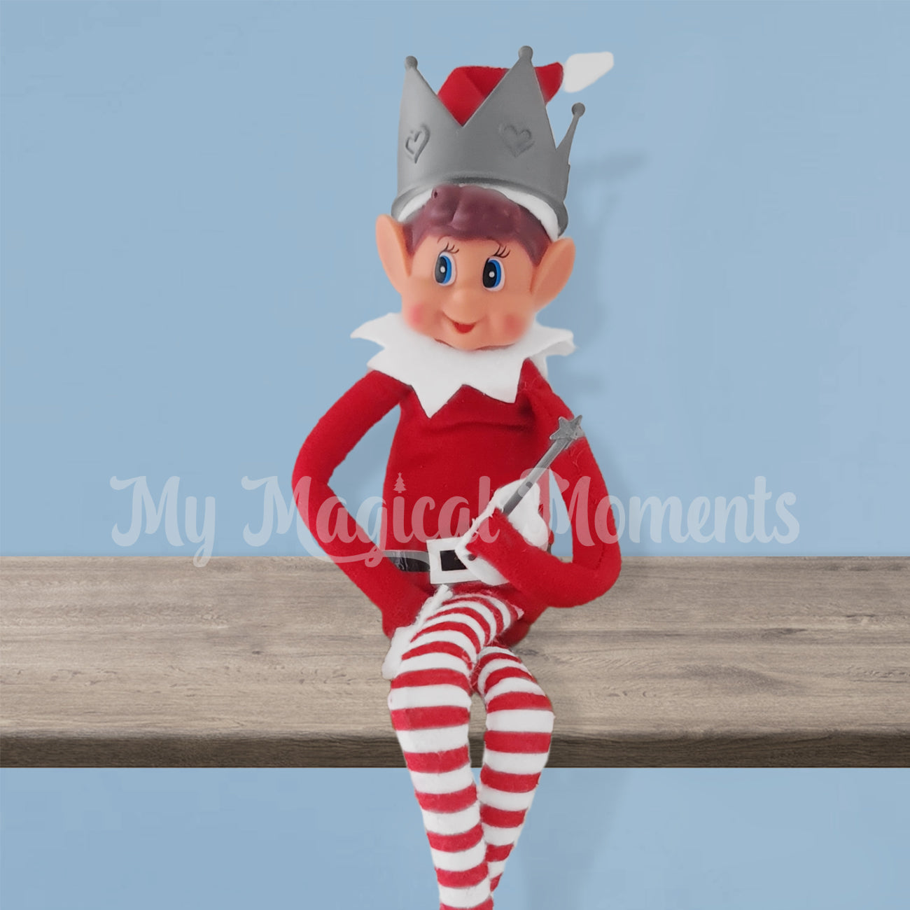 Elf wearing a crown on a shelf