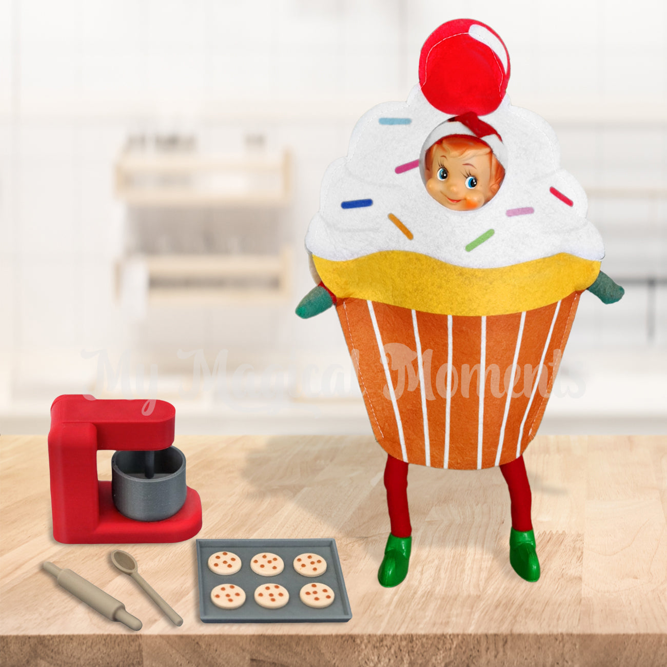 Elf as a cupcake with a miniature baking set, cookies and rolling pin