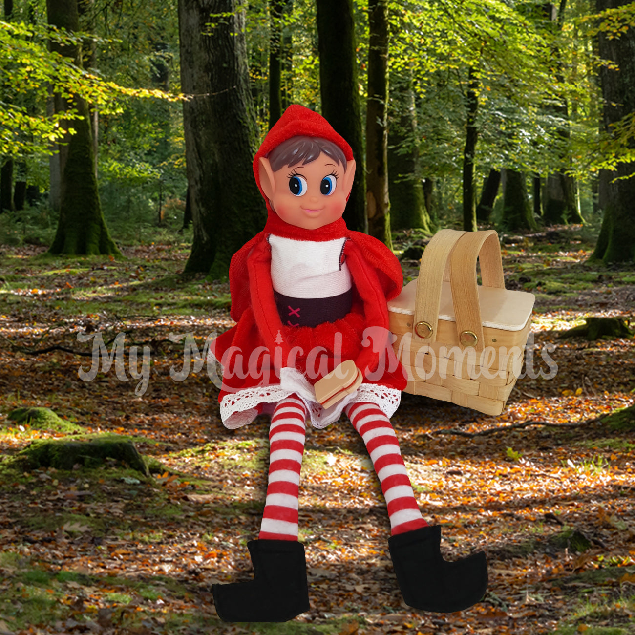Elves Behavin badly dressed as red riding hood and a elf sized picnic basket