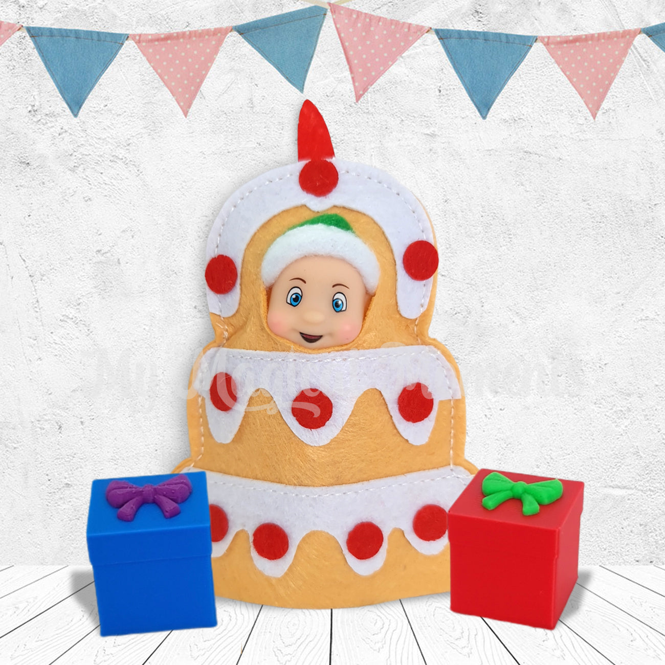 Elf baby dressed as a cake costume with presents