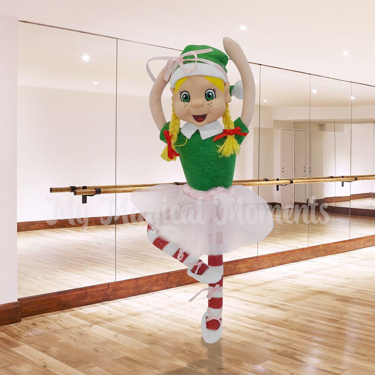 Elf wearing ballet shoes posing in a dance studio
