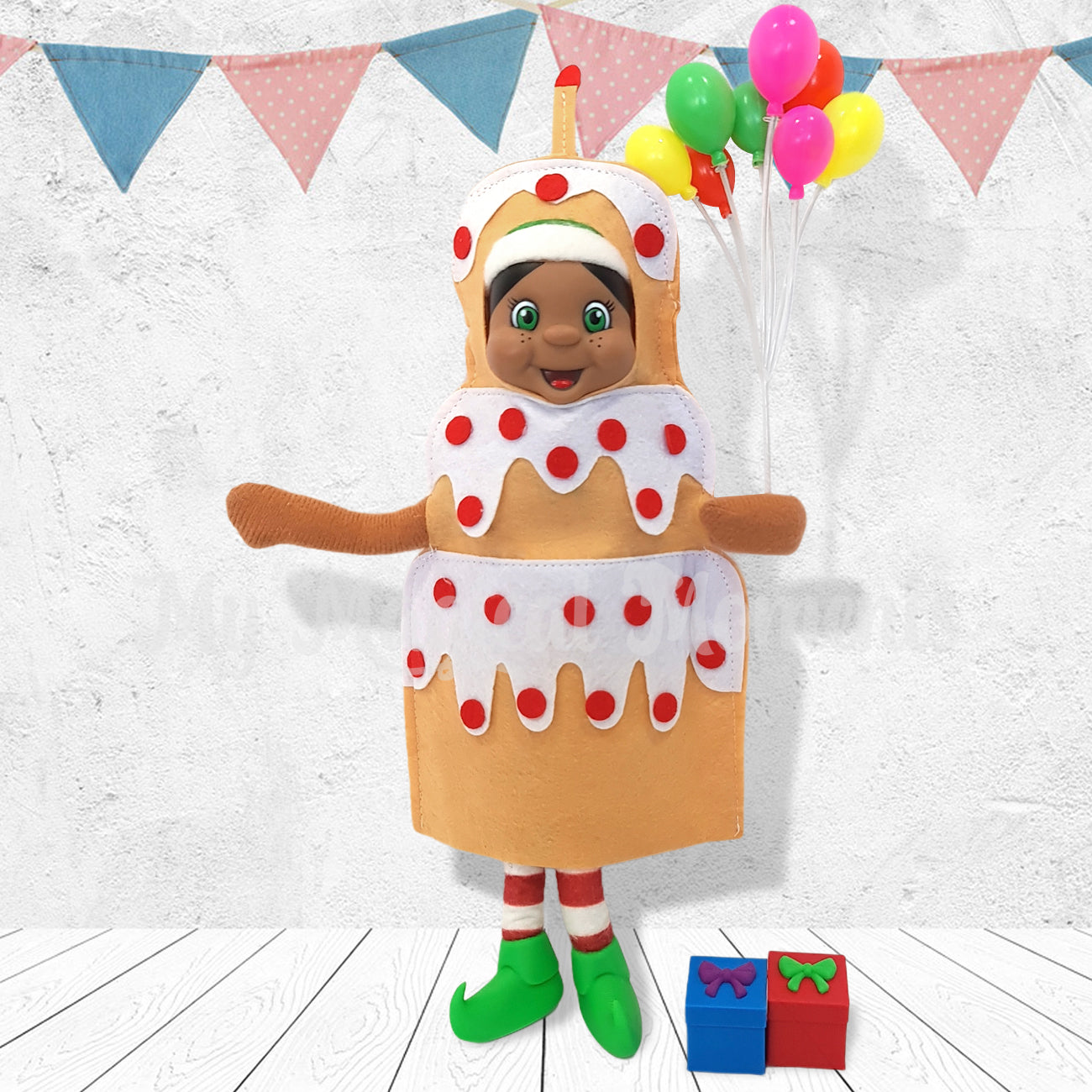 Black hair elf celebrating a birthday in a cake costume holding balloons and presents