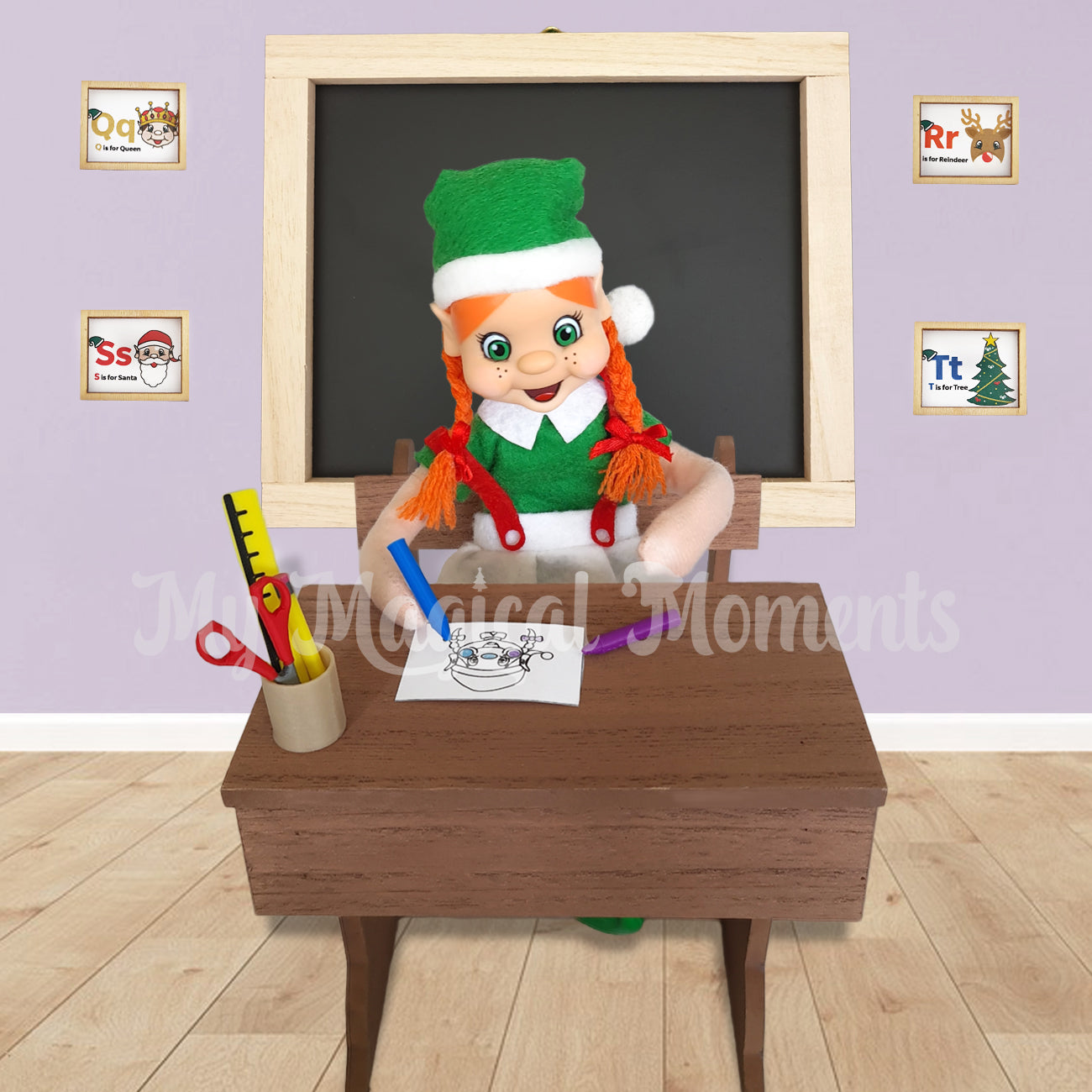 Orange Haired Elf colouring on miniature school desk with a crayon. Stationery on her desk and chalkboard behind