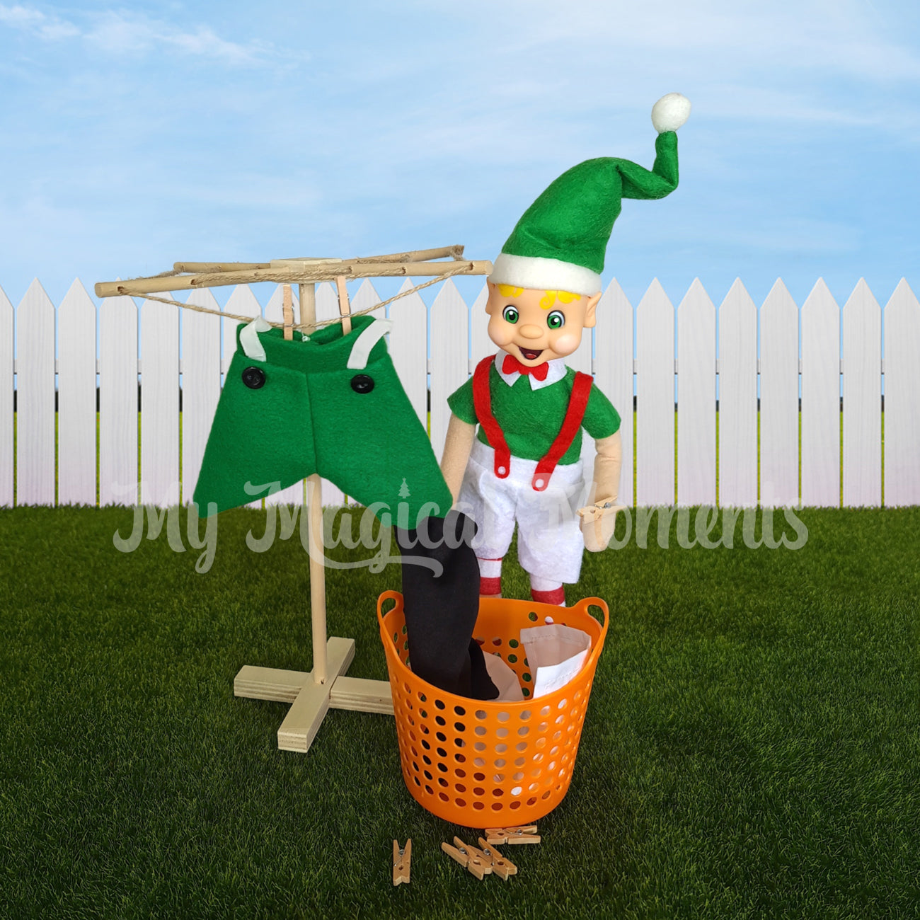 Elf hanging up washing on a miniature clothesline