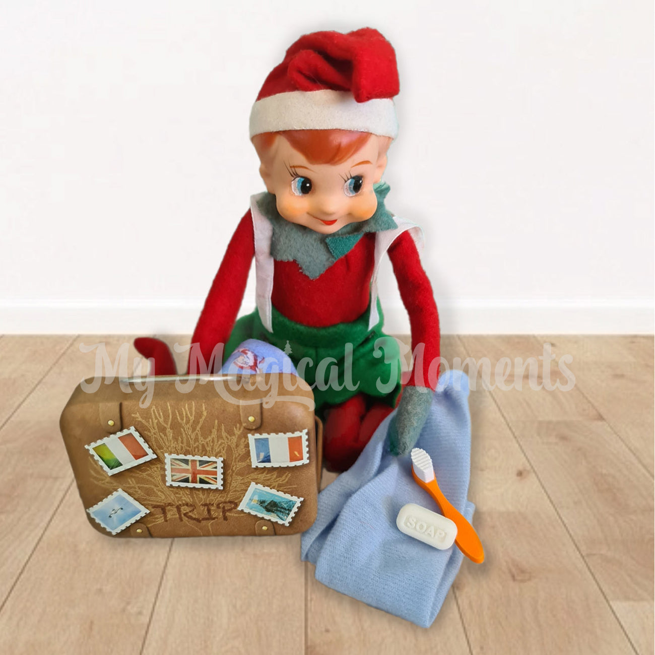 Elf packing suitcase with clothes and miniature toothbrush