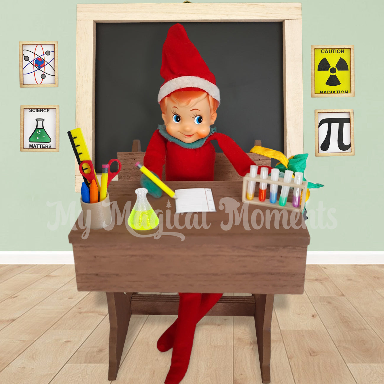 Vintage Elf sitting at a school desk with a miniature pencil, chemistry set and chalkboard behind them