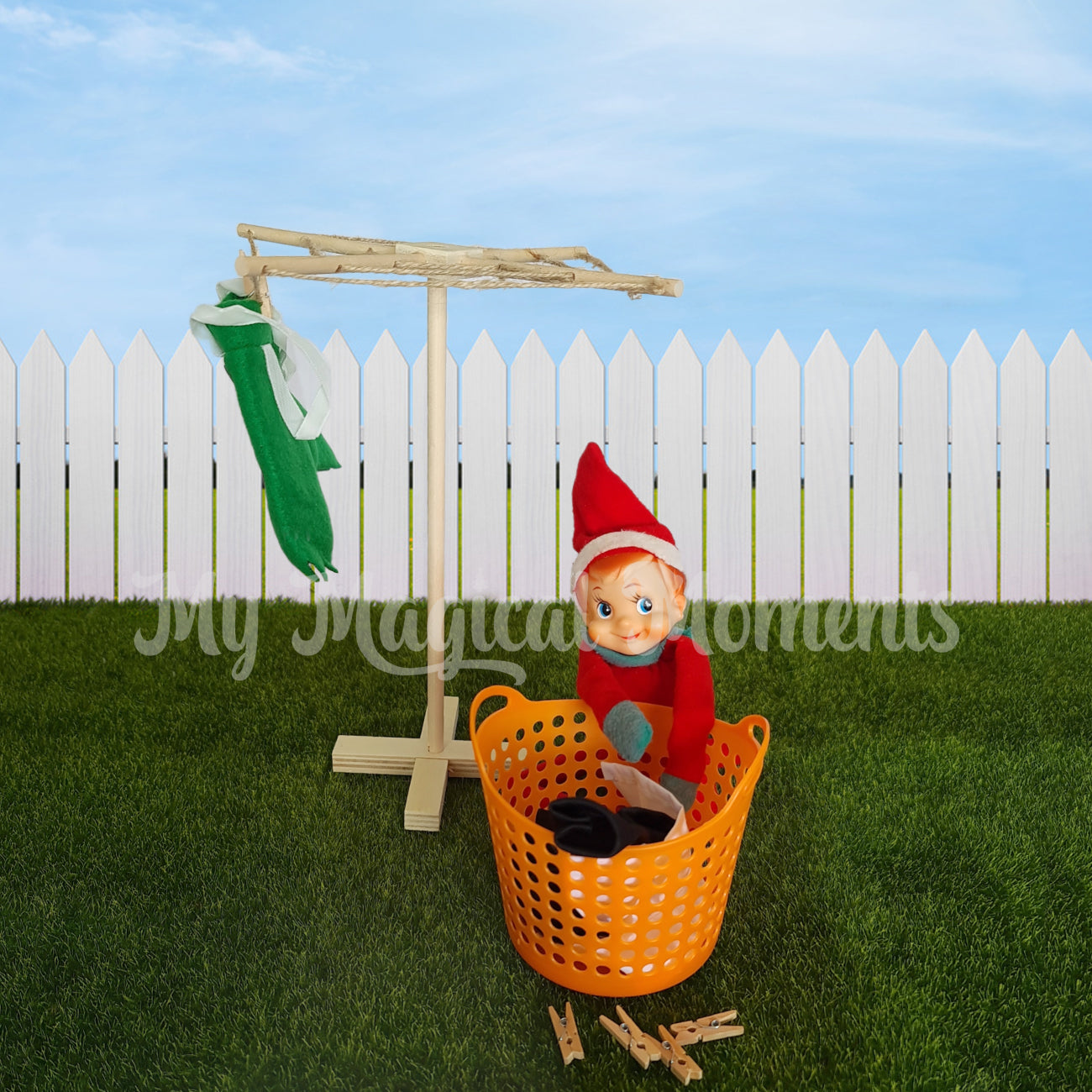 elf hanging washing with mini clothes hoist and basket