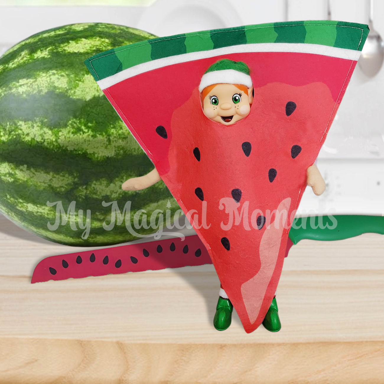 My Elf friends dressed as a watermelon in front of the fruit
