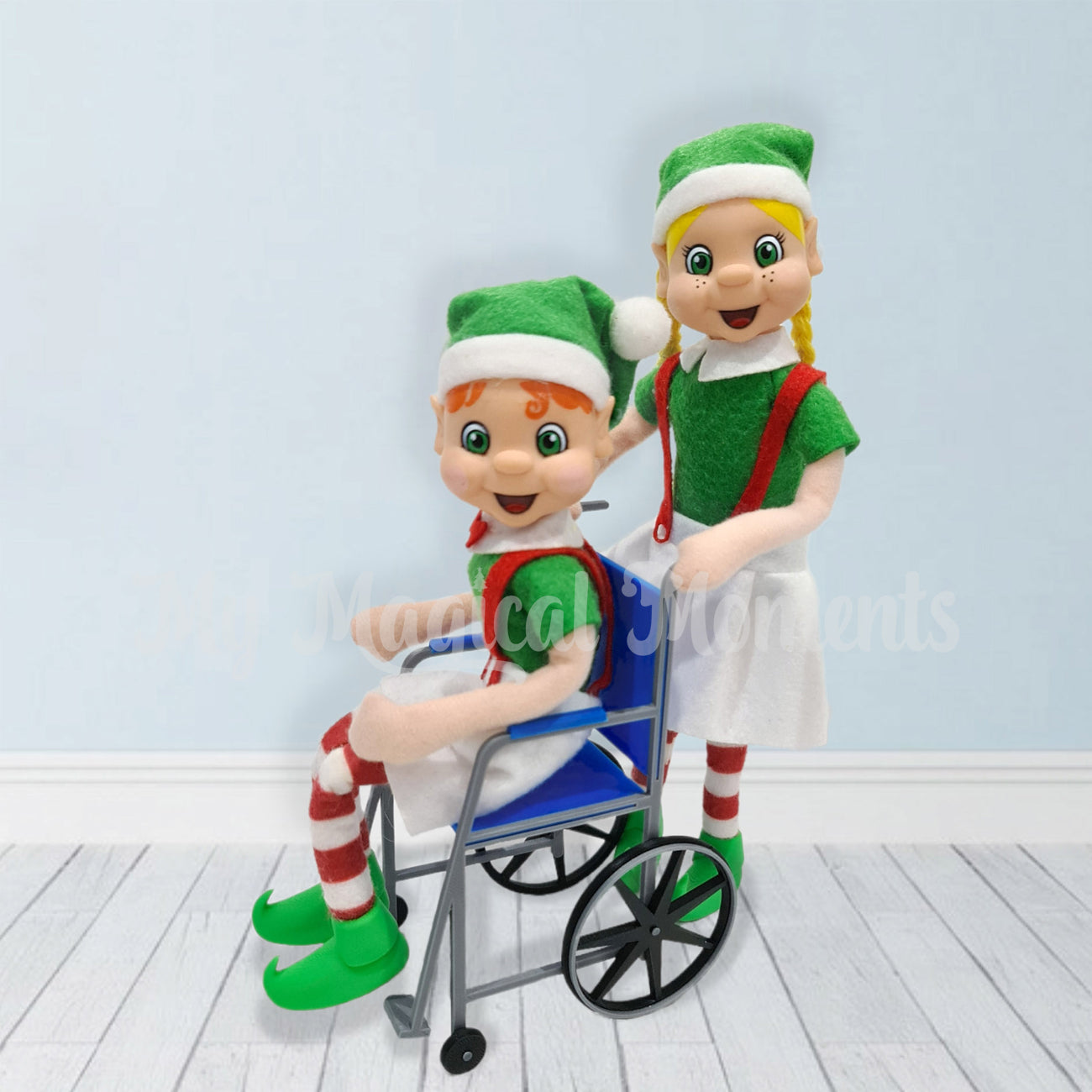 A blonde hair elf pushing a orange hair elf in a blue wheel chair