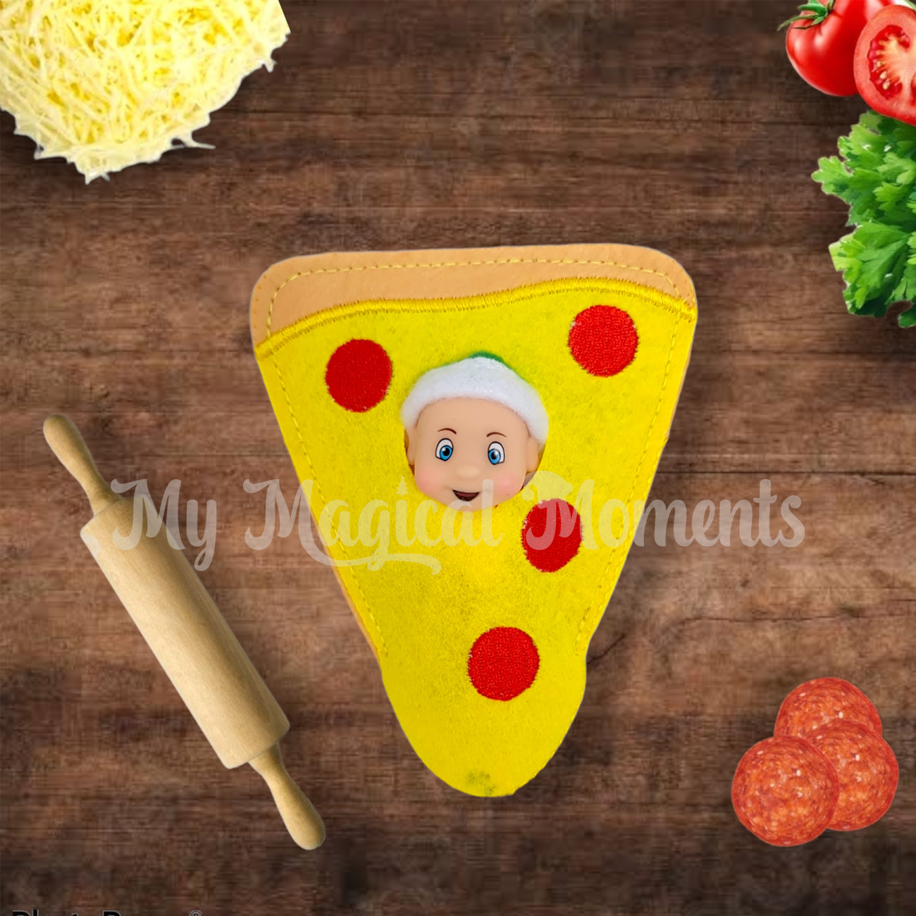 Elf baby dressed as a pepperoni pizza on a chopping board with cheese and a rolling pin
